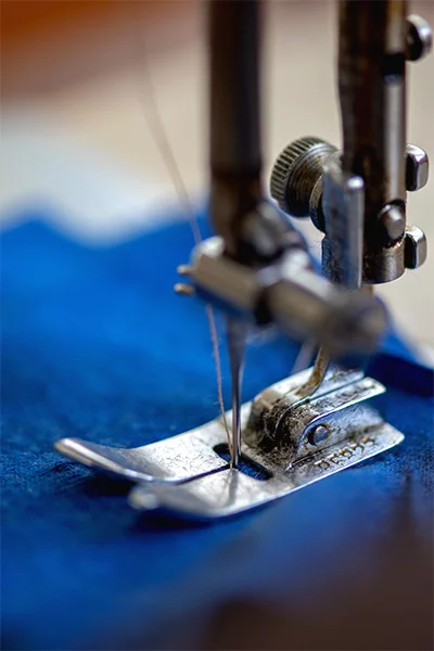 Close up of fabric being sewed