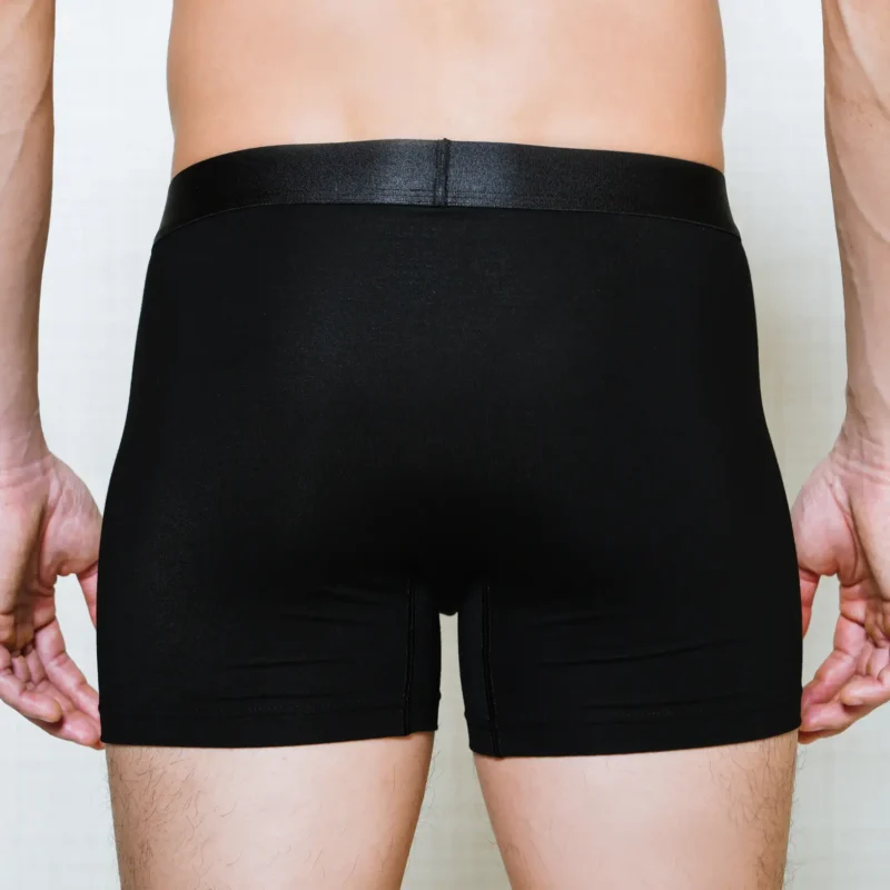 model wearing unwear onyx black boxer brief close up back