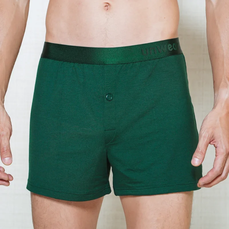 model wearing unwear noble green boxer shorts close up front