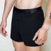 model wearing unwear onyx black boxer shorts close up side