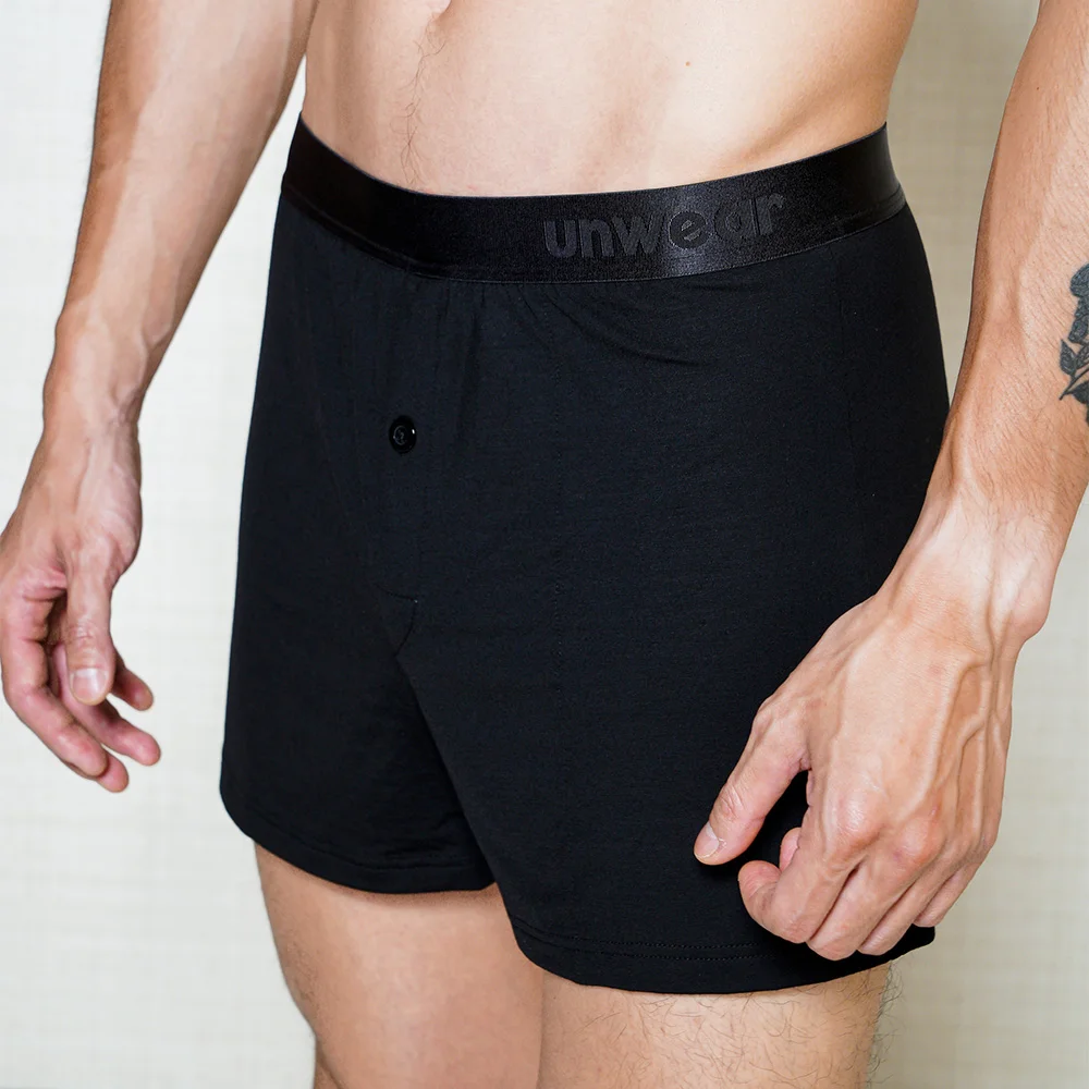 model wearing unwear onyx black boxer shorts close up side